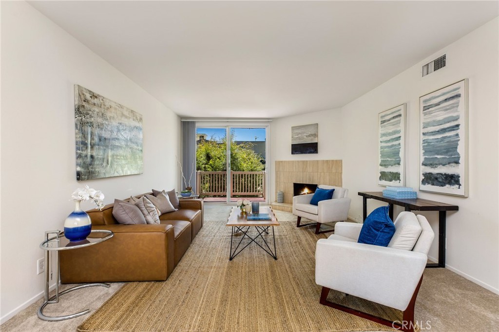 Welcome to this charming, turn-key top floor condo located in the heart of Sherman Oaks. This spacious 2-bedroom, 2-bath home features an open floor plan with two en-suite, primary-style bedrooms separated by a cozy and bright living room with a fireplace and large sliding doors leading out to a charming private balcony. The kitchen boasts tile counters, updated appliances and opens to the dining and living area for seamless entertaining. The unit also features newer carpet throughout, a built-in wet bar and a laundry area with side-by-side washer and dryer adjacent to the breakfast nook in the kitchen. The well-maintained complex includes secure access, gated underground parking with a total of 3 assigned parking spaces, an extra storage closet, elevator access, a large pool and spa, sun deck, and recreation room/lounge with direct access to poolside relaxation. Ideally situated moments from Westfield Fashion Square, two Trader Joe’s, Sherman Oaks Park, and all the vibrant shops and restaurants along Ventura Blvd.