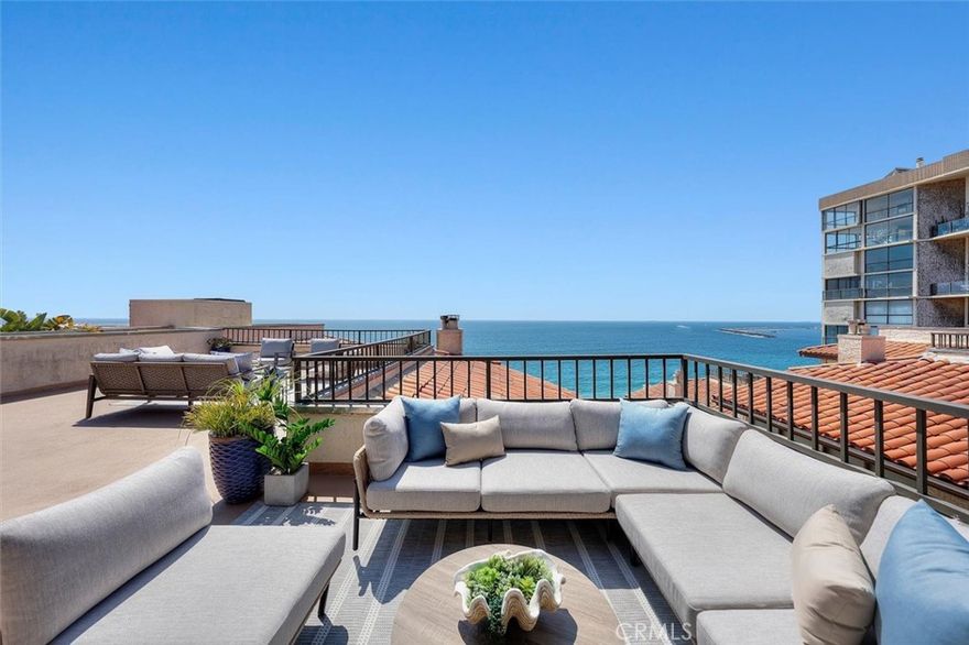 Experience the pinnacle of coastal luxury at this newly reimagined penthouse at 555 Esplanade — a rare opportunity to own an uncompromising oceanfront sanctuary on the sand of Redondo Beach. Completely remodeled and never lived in, this sophisticated residence is the embodiment of elevated design and effortless comfort. Step inside to discover interiors meticulously curated with a discerning eye for detail. Custom cabinetry, designer-selected hardware and elegant tile finishes by Ann Sacks, Sonoma and Akdo set an unmistakable tone of refinement throughout the home. The gourmet kitchen is appointed with top-of-the-line SubZero and Thermador appliances, making it as functional as it is beautiful. Premium Kohler and McGee & Co. plumbing fixtures further enhance the sense of quality and thoughtful craftsmanship. Soaring lofted ceilings fill the main living areas with natural light and volume. A custom-constructed steel loft creates an inspired family room space with sweeping ocean views. The primary living room upstairs offers direct access to an expansive 780 square foot upper deck, a walk-in closet with custom organization, and seamless indoor-outdoor flow for relaxed entertaining. The lower level hosts two spacious bedrooms, each featuring lofted ceilings and their own en-suite bathrooms, ensuring privacy and comfort for family or guests. A welcoming mudroom entry provides practical storage and an inviting transition from the beach to home. Three private outdoor spaces—including two patios off the main living area—culminate in a spectacular 600-square-foot oceanfront balcony, where unobstructed vistas of Palos Verdes, Malibu, and the Pacific create a daily backdrop of awe-inspiring beauty. Additional highlights include an in-unit washer and dryer, prime garage parking spaces and a level of craftsmanship rarely found along the coast. This is more than a residence—it’s a statement of timeless style and unparalleled beachfront living.