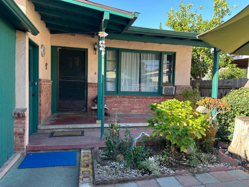 Welcome to this charming 3-bedroom, 1-bathroom fixer bungalow home located in the San Antonio area of Mountain View. Just a short 13 minute bike ride to Googolplex, Or a 9 minute bike ride down the California St. newly constructed bike safety corridor to vibrant downtown Castro St, where you can enjoy a banquet of friendly cafe's and restaurants. Or even closer to the San Antonio Center with Trader Joes, Safeway and Movie theater. Walk to Rengstorff park, with playground, tennis/pickle ball courts, Pool and recreation area. The kitchen has a gas oven range, and a refrigerator, includes a cozy breakfast nook. The home is equipped with central forced air gas heating and cooling options such as ceiling fans and window/wall unit. Flooring varies throughout the home, with a blend of laminate, vinyl/linoleum, and wood. Additional amenities include an outside laundry area with water and electricity hookup (220) and a storage facility. The garage/carport has a work bench and there is room for two cars in the driveway for off street parking. Located within the Mountain View Whisman Elementary School District, this property is situated on a spacious lot measuring 4,165 sq ft. Don't miss the opportunity to make this your new cozy and livable home ready for minimal or extensive updates!