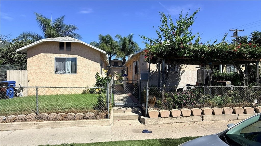 Photo of 823 W 81st ST, Los Angeles, CA 90044 (MLS # SW26202425)