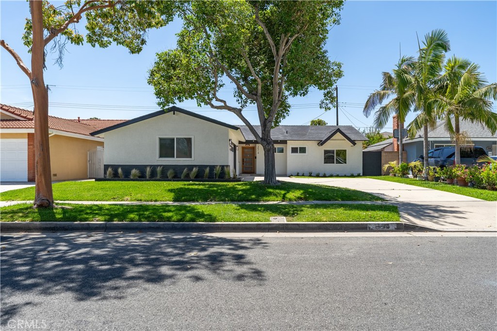Turnkey Beauty with Designer Touches
Fully renovated 3-bed, 2-bath single-story home with 1,431 sq ft of modern elegance. Features include white oak floors, a custom fireplace, chef’s kitchen with quartz countertops, shaker cabinets, dark stainless steel appliances, and a stunning primary suite with a spa-like bathroom.
Enjoy a private backyard with new landscaping, covered patio, and block wall fencing. Extras include central A/C, paid-off solar, recessed lighting, and more.
Stylish, energy-efficient, and move-in ready—this one has it all!