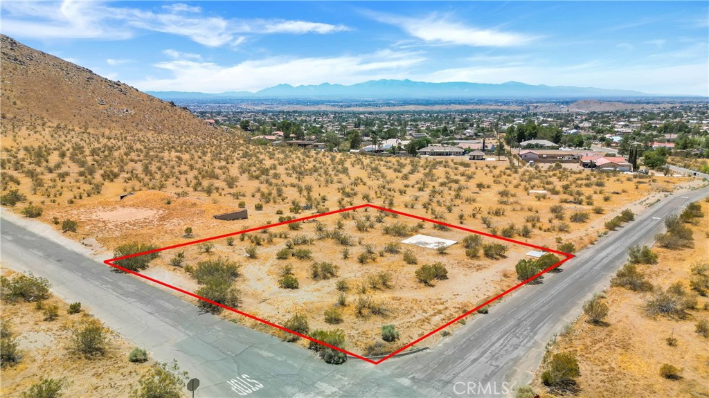 15,600 sq. ft. corner lot with water meter, amazing 360 degrees views, in growing APPLE VALLEY, CA. HUGE corner lot with no Joshua Trees approx. 154'+- on Roanoke Rd and 159'+- on Atoka Rd. neighbors go up and down that mountain in front of it every morning to exercise, quiet neighborhood, there is a home across the street about 450 feet from the site, there are beautiful home around the area, is only a short driving distance to St Mary's Hospital and all the businesses on Highway 18, easy access to all Apple Valley. And, just to name some of the fantastic family activities. Enjoy outdoor activities at Horsemen's Center Park, Silverwood Lake State Recreation Area, or Mojave Narrows Regional Park. Learn about local history at the Apple Valley Legacy Museum, the Victor Valley Museum, or the California Route 66 Museum124. Play golf at Apple Valley Golf Course. Dine at Mollie's Country Kitchen or shop at Apple Valley Commons or The Market at Town's End. Play different sports at the Lenny Brewster Park. or visit the Victor Valley Mall that is about 15 minutes from there that offer a fine restaurants experience at the Restaurants road on Bear Valley and the I15 with all the fine dining experience that includes the Cracker Barrel, Chilis, Bj's, PV's, Johnny Carino's, Roodhouse steak, Applebee's, Olive Garden, Outback's, Red Lobster, and many more, as well as movies and much more entertainment. Also easy access to the I15 north to Las Vegas and south to Rancho Cucamonga, Fontana, San Bernardino and all cities down bellow, other cities down bellow, about 40 minutes to the Ontario international airport. All this and So much more to do makes this a perfect location for your families new home. Easy to commute is less than 2 hours from Los Angeles on the 10 Fwy East to North on the I-15. PLUS, a train station is coming to Apple Valley, which will definitely add immediate equity value to your property. Brightline West has acquired property in the newly annexed area of Apple Valley for a high-speed rail station that will connect Southern California to Las Vegas.