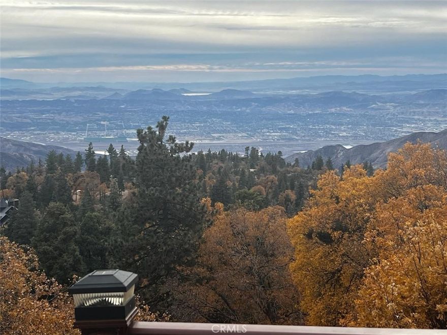 Ever wonder why this area is called 'Rim of the World'? Check out the VIEW on this amazing offering in Running Springs and you'll understand. From the ocean to the Anaheim Hills to Lake Matthews, you can take it all in through the gorgeous windows of this wonderful mountain home. At night, enjoy the transition to sunsets and city lights. With no houses behind you, these views will be yours for decades too. 

Having been custom built by its current owner, this beautiful home has all the signs of love and care and virtually no signs of wear and tear. It's ready for you to come with your suitcase and start making memories. There's a bedroom and a full bathroom on each floor for everyone's privacy and space. The main floor features vaulted tongue and groove ceilings, picture windows and a warm wood stove. Upstairs is currently the primary retreat with a luxurious bathroom fit for your relaxation. The lowest level of the house is a bonus den space that is currently a game room with wet bar and pool table. This is where the fun happens on game day! You'll also find the third bedroom and bathroom here. Two decks to absorb the views day or night also are featured at 2477 Spring Oak. You'll be happy to have both central A/C and furnace to keep the house comfortable in all seasons.

Don't miss this exceptional home on your next tour!