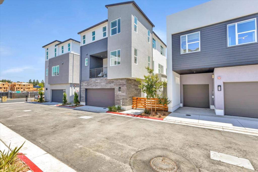 Courts Plan 1X corner unit features 4 bedrooms, 3.5 bathrooms, a 2-car side-by-side garage, quartz countertops, and Bosch stainless steel appliances. The first floor includes a bedroom with a private en-suite bath, ideal for guests or a home office. The second floor offers a spacious great room that integrates the living and dining areas with the kitchen, creating a seamless space for everyday living and entertaining. The third-floor features three additional bedrooms, including a primary suite with a walk-in closet. Energy efficiency is enhanced with solar panels, which can be leased or owned. This home is available for Spring 2026 move-in. Ownership is condominium. City Village by Summerhill Homes features 404 elegant residences and a 2-acre public park with walking and biking trails, seating areas, and a community barbecue spot. Located near San Ramon's City Walk Neighborhood and within walking distance to City Centers restaurants, movie theater, and retail shops, the community offers convenient access to amenities. Designed for easy access to schools, work, and public transit, City Village is also near Central Park, Canyon Lakes Golf Course, and Bridges Golf Club. The provided images reflect the model home exterior/interior. Visit our Sales Office today to tour home.