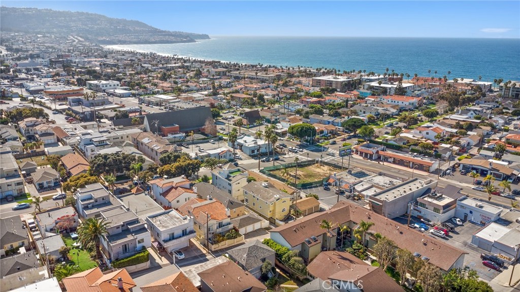 Great location, Walker’s Paradise only two blocks from the ocean & walking distance to Riviera Village. (91 Walk score) Free standing rear unit with small rear yard (patio). Perfect floor plan for entertaining . Automatic gate in rear, smooth stucco on exterior, stone on walkways & exterior patio. Split levels, 2 car garage with acid stain finish and electric car charging outlet, exercise room, huge large laundry room new washer and Dryer with lots of cabinets and counter space including sink, two large closets in hallway. Double door entry with vaulted ceiling. Wood floors throughout 3 BRS on entry level & 2 baths & Family room with fireplace , balcony, & oversized wet bar. Top floor living room with fireplace, balcony with ocean peak views, and formal dining room. New kitchen, stainless steel appliances including fridge & wine cooler, Guest bath, main bedroom with balcony, vaulted ceilings, ocean peak, walk in closet & remodeled bath with huge linen closet. Central Air and heat, all bathrooms with with bidet toilet seats.Top-rated schools including (Tulita Elementary School) Major remodeling was just completed February 2025