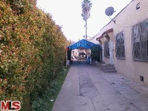 Photo of 1424 MEADOWBROOK Avenue, Los Angeles, CA 90019 (MLS # 12595401)