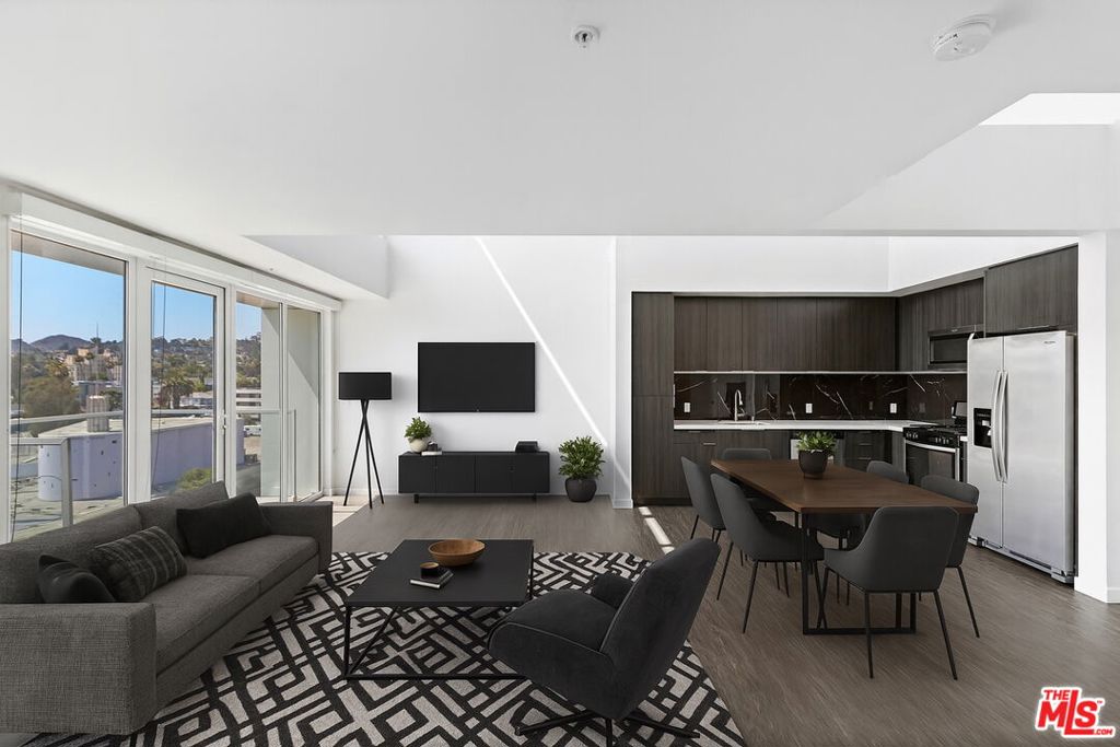Welcome to Fusion Hollywood Apartments, where luxury meets the iconic spirit of Hollywood living. Located in the heart of the Entertainment Capital, Fusion offers a bold new standard in modern apartment living. A perfect balance of live-work-play. From the cinematic-inspired facade to the rooftop with Hollywood Hills views, every detail is designed to elevate your lifestyle. This unit is a 1 bedroom, 2 bathroom loft-style apartment with in-unit laundry, stainless steel appliances, and polished finishes. Community amenities include a resort-style rooftop deck, in-ground hot tub, fitness center, yoga studio, pet spa, co-working lounge, and BBQ courtyard. Just steps from Hollywood Blvd, the 101, the Metro, and world-class dining and nightlife, this is your front-row seat to it all! If you've just moved to LA, the unit can be delivered furnished or unfurnished. Landlord requests proof of income at 3X rent. Contact listing agents for rental incentives and application details.