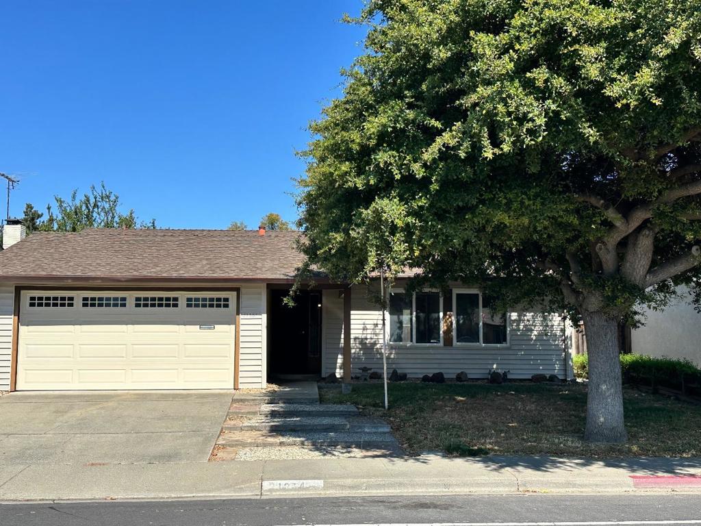 On the market for the first time in more than fifty years! Spanning 1,311 sq ft, this house features 3 bedrooms and 2 full bathrooms, providing ample space for families. Its living room/dining area/family room/kitchen offer a multitude of potential configuration options for whatever you need: home office, gaming center, kids' playroom, etc. Conveniently located next to major commute routes and all the shops and amenities you could ask for, you will have easy access to work or play. This home has a flat fenced yard for entertaining, it backs to parkland for more peace and privacy than its neighbors, and with your updates and fresh design, it will be a fantastic home for years to come. The house has been well loved and stands ready to welcome its next owners for an exciting new chapter. The property is equipped with Central AC and Central Forced Air - Gas heating, ensuring comfort throughout the seasons. Practical amenities include a laundry area for added convenience and a 2-car garage providing ample storage space.