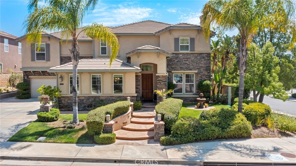 This gorgeous home in Tesoro Del Valle is priced to sell! Featuring rich brown hardwood floors, open concept kitchen with newer granite countertops, stainless steel appliances, and impressive pantry space. The grand master bedroom features a sitting room, stunning city views and luxurious and large master bath with walk in closet. Also upstairs is a bonus family room with access to 2 bedrooms. The wrought iron staircase compliments the luxe finishes in this spacious and remarkable property. Continue to take advantage of the view with a private pool, spa and waterfall in the backyard complete with built in BBQ. The HOA features access to a clubhouse/banquet facility, pools, spas, tennis courts, baseball ground, gym and a beautiful lake. Quite a gem in the highly desirable Tesoro Community!