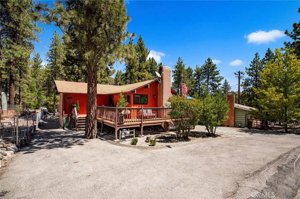Escape to this warm and inviting Wrightwood cabin home with breath taking mountain views. This charming 2 bed 1 bath single story home features vaulted wood ceilings and a cozy floor-to-ceiling brick fireplace for those chilly winter days. The kitchen has been upgraded and there is seating at the bar as well as the dining area. Most of the home has been recently painted.New windows, all new doors and slider, including new security screen doors. Most of the electrical and plumbing has been upgraded.
The sliding door off of the livingroom brings in lots of light and opens to a 180 degree wrap around porch -perfect for soaking in the crisp mountain air. The porch also offers lots of space to entertain guest.
The bedrooms are nice size w lots of storage in the closets. Beautiful and serene views of the trees plenty of places to eat, shop, ski at Mountain High Lots of storage under the home with a possibility to make it a room conversion (check with city)This beauty is minutes from downtown and Mountain high, for skiing, snowboarding, tubing.There is also Hiking, camping & fishing,Very friendly supportive community.Christmas tree lighting and so much more. The streets are plowed reguarlly during the winter season.
Ideal for year round living or a peaceful getaway.