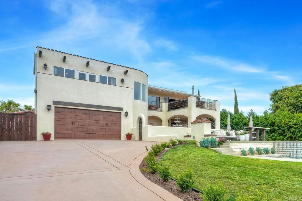 Coastal Elegance in the Heart of Leucadia –This beautiful 5 bedroom/4 bath home West of I-5 with Panoramic Ocean Views & a separate 2 bedroom/1 bath ADU is just moments from the beach in one of Leucadia’s most coveted neighborhoods. This gated Spanish-influenced two-story estate sits on a large lot and offers sweeping ocean views, timeless architecture, and luxurious modern amenities. A grand, tiled courtyard with a tranquil fountain sets a serene tone as you enter the main home. The lower level features three bedrooms and 2 bathrooms (including one en-suite), a spacious living room with a large wood-burning fireplace, a fully equipped kitchen, and separate laundry—an ideal setup for guests, extended family, or independent living. A custom iron staircase leads to the upstairs, where the ocean views steal the spotlight. The expansive great room features a chef’s kitchen with a large Perla Venata quartzite island, hand-painted Tabarkca tile, and custom wood beams. This stunning open-concept space flows through panoramic doors onto a large deck with a gas fireplace—perfect for sunset gatherings or relaxing by the fire and enjoying a glass of wine with friends. The upper level also includes the luxurious primary suite with private ocean view balcony, an additional bedroom, a laundry/craft room, and a beautifully designed guest bath with a clawfoot tub and artisan tile. Throughout the home, rich solid alder doors and engineered wire-brushed oak flooring bring warmth, texture, and craftsmanship to every room. Each level is complete with its own kitchen, living area, and laundry, making this home ideal for multigenerational families or separate area for guests. Enjoy resort-style outdoor living with a sleek modern salt water pool and spa, outdoor bar, and gas fireplace—all easily accessed from both levels via a custom exterior staircase. Mature fruit and citrus trees throughout the beautiful landscaped yard as well as a detached workshop/office. Adding to the appeal, this property includes a fully detached 2-bedroom, 1-bath ADU (casita) with its own private yard, separate parking, full kitchen, living room, separate laundry, and storage room. Completely separate from the main house. Rv parking on site. Located west of I-5 in Leucadia, just minutes from beaches, surf breaks, coffee shops, and all the laid-back charm of this iconic beach community.