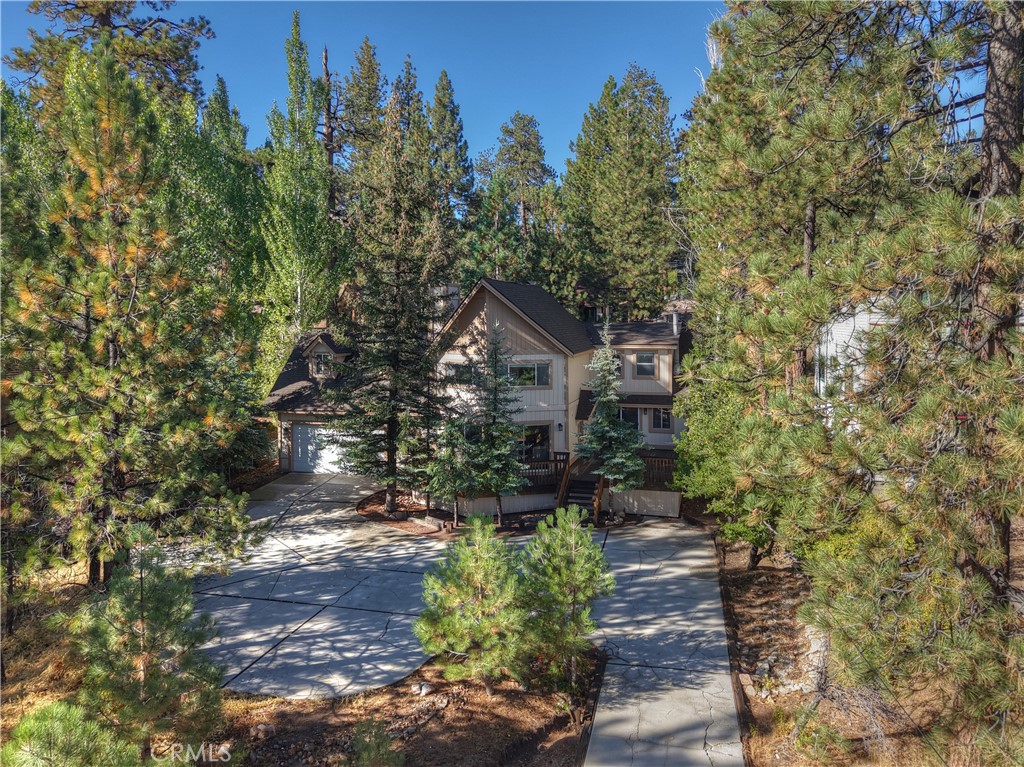 Welcome to the Cienega Chalet—your perfect mountain retreat just steps from the lake! On the market for the first time in over 23 years, this cherished home has been enjoyed by a large three generation family and is now ready for new owners to create lasting memories. Offering 3 bedrooms, 1 bath, and 2,313 sq. ft. of living space with a 2-car garage, this home blends rustic charm with thoughtful updates. Step inside and be greeted by a wall of windows and sliders that fill the home with natural light and fresh mountain air. Newer LVP flooring flows throughout, while the fireplace invites you to cozy up after a day on the lake or the slopes. The updated kitchen is a dream, featuring quartz countertops, stylish gray cabinetry, and newer appliances—all designed for both functionality and style. Upstairs, spacious bedrooms provide the ideal retreat for family and guests, making this home perfect for multi-generational living or entertaining. Outside, the fully fenced backyard offers privacy, security, and room for pets to roam. The newer roof, washer/dryer, and ample parking add to the home’s convenience and peace of mind. Nestled among the trees yet only a short walk to the lake and local marina, this property delivers the ultimate combination of privacy and accessibility. Whether you’re seeking a weekend getaway or a full-time residence, the Cienega Chalet offers a true mountain lifestyle filled with comfort, charm, and natural beauty.