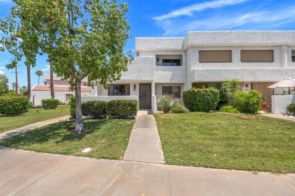 Welcome to this stylishly remodeled townhouse located in a quiet, gated community with resort-style amenities. This 2 BR, 2 BA home has been thoughtfully upgraded with modern finishes, an open layout, and breathtaking mountain views throughout.Step inside to soaring ceilings and a dramatic custom staircase that immediately catches the eye. The expanded kitchen features brand-new cabinetry, quartz countertops, all-new stainless steel appliances, and a seamless flow into the dining and living areas, perfect for entertaining.The main floor includes a spacious guest bedroom and fully remodeled bathroom - ideal for guests or a home office. Upstairs, the private primary suite offers a serene retreat with its own balcony, stunning views, dual vanity sinks, quartz counters, and a custom-tiled shower.Enjoy your private patio, perfect for morning coffee or evening relaxation. Additional features include a 2-car garage, new tankless water heater and 3M Prestige window film for energy efficiency, and low HOA fees. Community amenities include two pools and spas, a clubhouse, tennis courts, and pickleball courts.Move-in ready, and packed with style--this is a must-see!