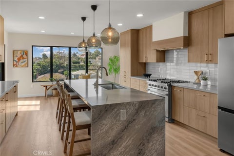 Photo of 5309 Maymont Dr, Los Angeles, CA 90043 (MLS # DW26166177)