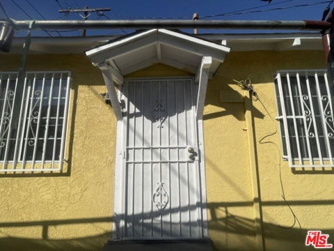 Photo of 702 W Vernon Avenue, Los Angeles, CA 90037 (MLS # 26103704)