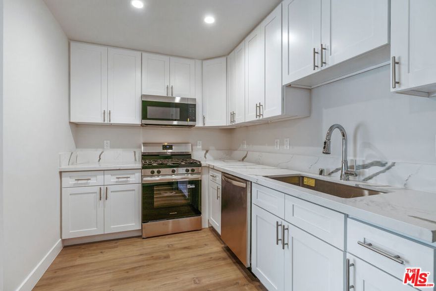 Completely remodeled 3-bedroom, 2-bathroom unit featuring a sleek, modern design with elegant touches throughout. This bright and spacious apartment offers a wonderful array of amenities to enhance your living experience. The updated kitchen boasts a full stainless steel appliance package, including a stove, refrigerator, microwave, and dishwasher. You'll appreciate the recessed lighting , wall AC's, and mirrored closets in each bedroom. Beautiful hardwood floors flow seamlessly throughout the entire unit, and for added convenience, a washer and dryer are included within the apartment. This unit enjoys a prime central location, providing easy access to major shopping centers, fine dining establishments, and the renowned entertainment studios of Culver City, as well as the beautiful beaches of Santa Monica and Venice. Commuting is a breeze with convenient access to the 10 and 110 freeways, the Metrolink Transit, and various bus lines. Whether you're heading to the beach cities, Mid-Wilshire, or Downtown Los Angeles, this location offers unparalleled convenience.
