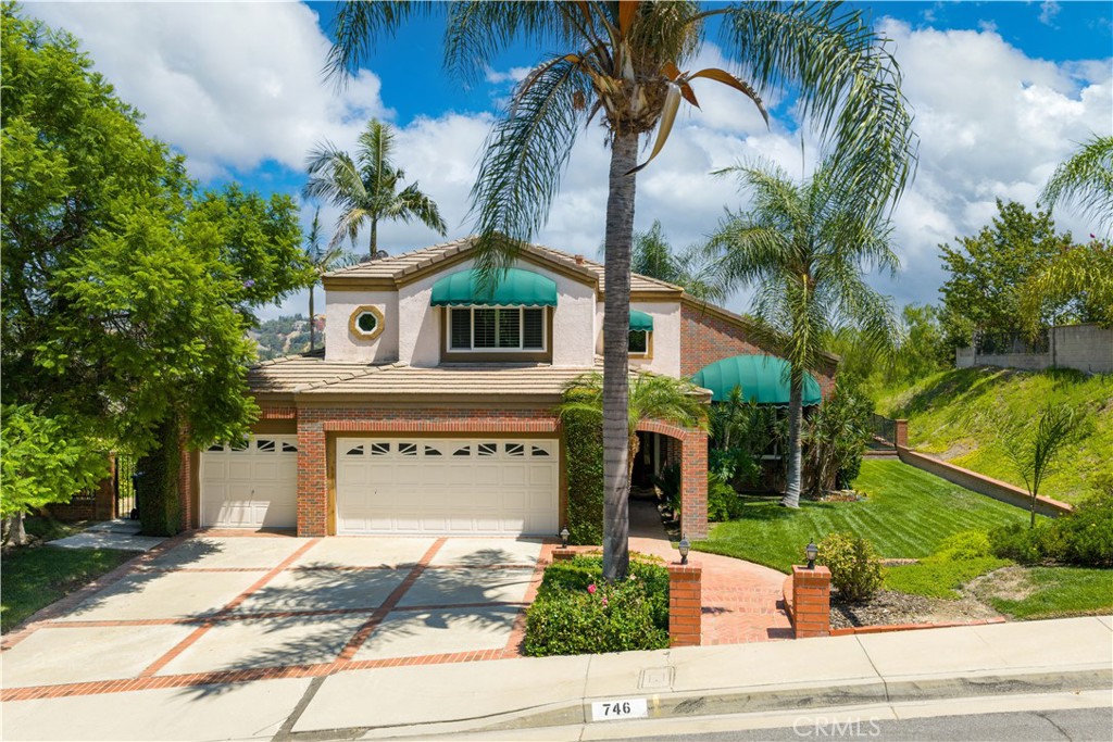 VIEW, VIEW, VIEW! First time on the market since 1987, this beautifully maintained home is located in the prestigious Snow Creek Community on a quiet street within the award-winning Walnut Valley School District.
This spacious residence offers 3 bedrooms plus a versatile den (optional 4th bedroom) and 3 full bathrooms, including one bedroom and a full bath conveniently situated on the main floor.
Step inside to a formal foyer that opens to a dramatic high-ceiling dining room, creating an elegant and welcoming atmosphere. The bright, open floor plan flows seamlessly into the gourmet kitchen, complete with granite countertops and stainless steel appliances, which opens to the family room with a cozy fireplace. French doors lead to the private backyard featuring a spa and firepit—an ideal space to entertain or relax while enjoying the panoramic views.
Upstairs, the luxurious primary suite boasts a separate sitting area, a spacious walk-in closet, and a beautifully updated bathroom with dual sinks, granite countertops, a soaking tub, and a separate shower. Two additional bedrooms share a full bath, while the upstairs den offers flexibility for a home office or optional fourth bedroom.
Additional highlights include a three-car attached garage and an unbeatable location—just a short walk to Snow Creek Park and close to top-rated schools, City Hall, the library, shopping, dining, banks, and Mt. SAC College. With easy access to the 60, 57, and 10 freeways, this is a rare opportunity to own a home in one of Walnut’s most desirable neighborhoods.