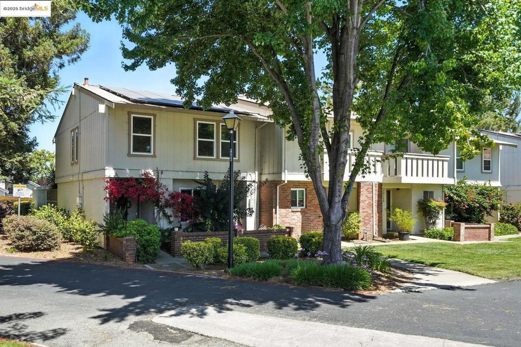 Welcome to your new oasis at 1814 Wildbrook Court, Unit D in Concord, CA! This fresh, end unit, 3-bedroom, 2-bathroom townhouse stretches over 1,468 square feet and lives like a single-family sanctuary with a 2 car garage + solar panels. Easy, level, and open main floor living space features a flowing floor plan of living, dining and kitchen, a creative speakeasy bar nook, and dedicated laundry area adjacent to a half bath. Access to a private patio and the garage is just a few steps from the sliding patio door for easy load/unload of groceries, kids, pets or stuff! Upstairs are 3 bedrooms and a unique jack and jill style hall/primary suite bathroom with stall shower, shower over tub and separate vanity. Out the front door is a welcoming porch to greet your neighbors and beautifully maintained common green lawns and a seasonal community pool. With a well-funded HOA, rest easy knowing your community is financially secure. This pet-friendly community also includes guest parking, so space is never an issue. DT Concord, BART, Ranch 99 and even the new Whole Foods on Ygnacio is a mere 14 minutes away. This hip home is more convenient than you’d think and ready for your personal touch—come discover this hidden gem waiting for you at 1814 Wildbrook Ct #D.
