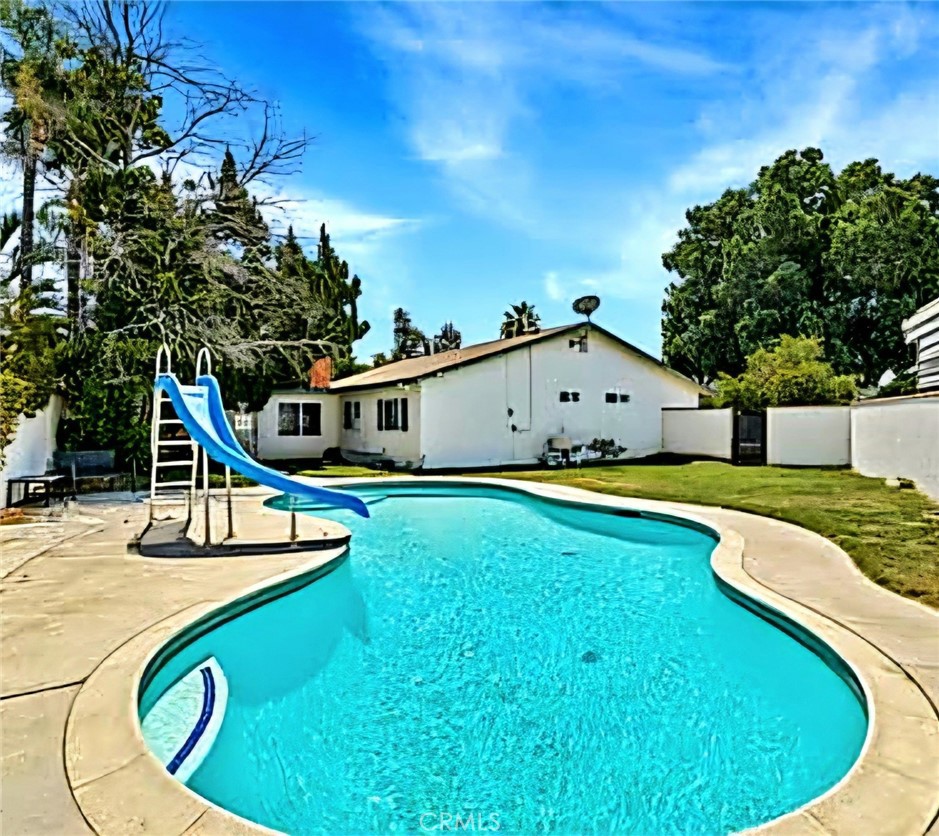 Come experience this single-story Riverside charmer in The Lake Shore Garden Community at Fairmount Park. This well-maintained home offers 4 spacious bedrooms, and 2 full bathrooms, spanning across 1,505 sq ft of thoughtfully designed living space. The kitchen is beautifully remodeled with ample cabinetry and counter space perfect for daily living and entertaining. The living room features a cozy fireplace, ideal for cuddling on those chilly winter nights. Step outside to your private backyard oasis, complete with sparkling pool and slide, perfect for summer fun in the sun. In addition, mature fruit trees offer both beauty, bounty and shade. The property also includes additional square footage (unpermitted), offering added flexibility to suit your lifestyle. Tucked away in a peaceful neighborhood, this home is just minutes from Fairmount Park, a local gem, offering fishing, boating, trails, and much more. Don't miss your opportunity to own this delightful Riverside gem that blends comfort, charm, and convenience.