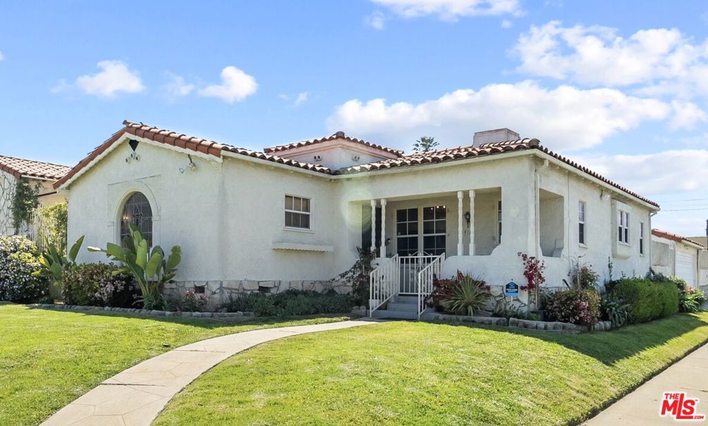 Welcome to this charming Spanish Revival 3-bedroom, 3-bath home in the heart of Los Angeles. Each bedroom has its own full bath, offering comfort and privacy for families, guests, or shared living.The primary suite feels like a retreat with hardwood floors, a walk-in closet, and a spa-inspired marble bath with soaking tub, shower, and dual vanities. Additional bedrooms feature natural light, hardwood floors, and updated baths.Upgrades include a full re-pipe (2021), updated electrical, original hardwood floors, and new marble, tile, and laminate finishes. The gourmet kitchen boasts Bosch appliances, a 7-burner chef's stove, and French door refrigerator. The living and dining areas are anchored by a restored fireplace, vintage Deco-era fixtures, and curved plaster ceilings, blending timeless 1930s character with modern updates. Outdoors, enjoy a private backyard with patio, BBQ, and garden. A two-car garage offers parking, storage, or ADU potential. Additional features include a security system, laundry with sink, and a spacious courtyard.Located on a manicured corner lot less than 2 miles from SoFi Stadium and minutes from LAX, USC, Marina del Rey, Venice Beach, and UCLA, this home combines style, comfort, and convenience. Must see in person. Views and space far better than photos. Call for your tour today