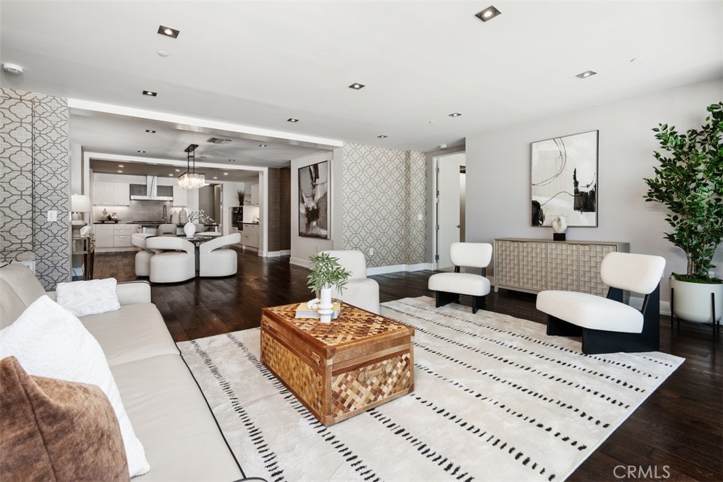 Introducing the penthouse at 432 N Oakhurst #503, a sophisticated 2-bedroom, 3-bath residence in one of Beverly Hills’ most prestigious addresses. Encompassing approximately 2,020 square feet, this home offers an expansive and thoughtfully designed floor plan with elegant finishes throughout. The open living and dining areas are ideal for entertaining, enhanced by floor-to-ceiling windows that bathe the space in natural light. A chef’s kitchen with top-of-the-line appliances and sleek cabinetry anchors the home with both style and function. The two bedrooms are generously appointed with en-suite baths, including a luxurious primary suite with a spa-inspired bathroom and ample closet space. This penthouse also features its own secluded rooftop terrace—a private retreat perfect for enjoying panoramic city views, al fresco dining, or relaxing under the stars. Additional highlights include hardwood flooring, high ceilings, three parking spaces, and the security and convenience of a full-service luxury building. Ideally located in the heart of Beverly Hills, this penthouse blends modern comfort, privacy, and lifestyle in an unmatched setting.