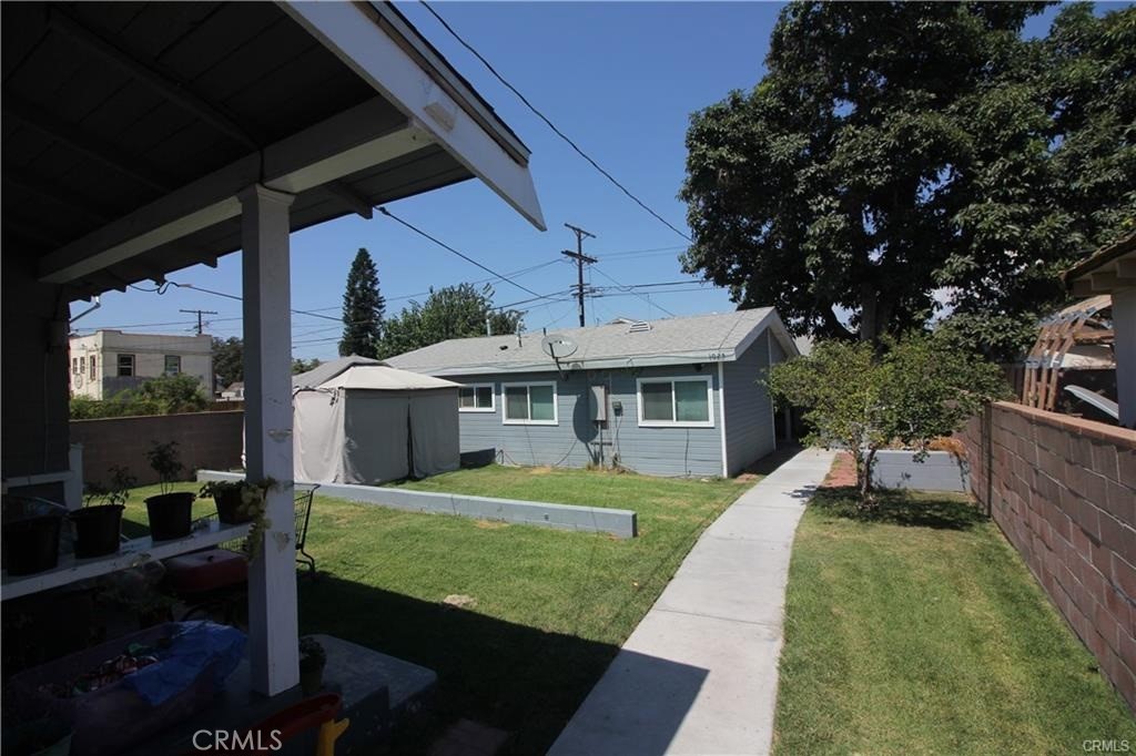 Recently restored Craftsman home plus virtually new ADU on a large lot near USC, the Los Angeles Memorial Coliseum and LAFC soccer stadium. The front home is approximately 1,680 sq. ft. with 3 bedrooms and 1.5 bath featuring a spacious living room with a gorgeous stone fireplace, recessed lighting and a lovely color palette along with beautifully restored hardwood floors. There is an additional den and private laundry and a study room with plenty of natural light. The kitchen has gleaming white cabinetry, stainless appliances and quartz countertops. The dining room has a built-in original china cabinet and a gorgeous chandelier. The main house currently rents for $2,964 a month and the ADU which is also a beautifully appointed 2 bedroom 2 Bath is currently renting at $2,288 a month and is approximately 864 sq. ft.(Buyer to Verify) This is a terrific home and income or straight income property.