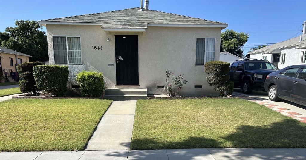 Well-maintained and move-in ready duplex located in a clean, quiet North Long Beach neighborhood with great curb appeal. The front unit is a 1 bed / 1 bath featuring new wood-look flooring, fresh paint, recessed lighting, and a remodeled bathroom with tiled shower. It has both front and back entrances. Estimated rent potential of $2,000/month. The back unit is a spacious 3 bed / 2 bath with a brand-new central air conditioning and heating system, new kitchen flooring, and laminate wood floors throughout. The bathrooms are in great condition, and the layout receives plenty of natural light. Currently rented month-to-month. Double-pane windows, electrical is wired to comply with current code, and the entire property was fumigated in February 2025. Separate Gas and Electric meters. Common Water meter. The exterior is neat, clean, and well cared for, with a long driveway that provides plenty of parking, a detached garage, and a private backyard with a large covered patio—perfect for relaxing, entertaining, or gardening. The street has a very tidy and peaceful feel—homes are well-kept and neighbors take pride in their properties. This is a great setup for an owner-user or investor. Live in one and rent out the other!