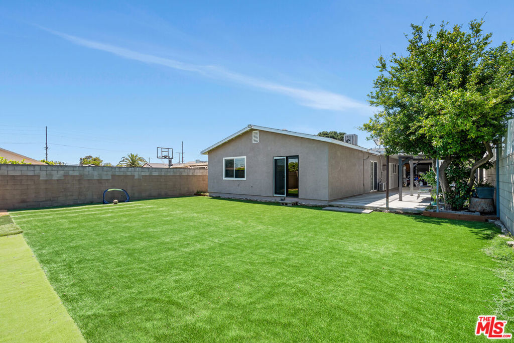 Check the comps. This is one of the lowest priced (per-square-foot) homes on the market in Pacoima and it's move in ready. The flexible layout of this home provides the buyer with a variety of options, making it ideal for multi-generational living or for an investor/buyer looking for a home that offers additional rental income potential or needs more room for extended family. This home features 3 separate studio units each with their own kitchenettes, bathrooms and outside entrances. In total, this beautifully upgraded home has 6 bedrooms and 5 bathrooms and features 2,135 square feet of living space all on one floor and it sits on a big 7,500 square-foot lot. The home is light, bright and extra-clean featuring a comfortable living room, separate dining room and a spacious kitchen that features new Shaker cabinets, quartz counters, porcelain flooring and a 36" Viking range. There is a separate laundry room adjacent to the kitchen. Recent updates include newer flooring, lighting, cabinetry, central HVAC, energy-efficient windows, low-maintenance landscaping and more. The large rear yard is ideal for outdoor activities. There is a covered, tree-shaded pergola providing a nice spot for outdoor dining or just relaxing. The property is gated with an attached garage + additional driveway parking. This lovely home is vacant and move-in ready.