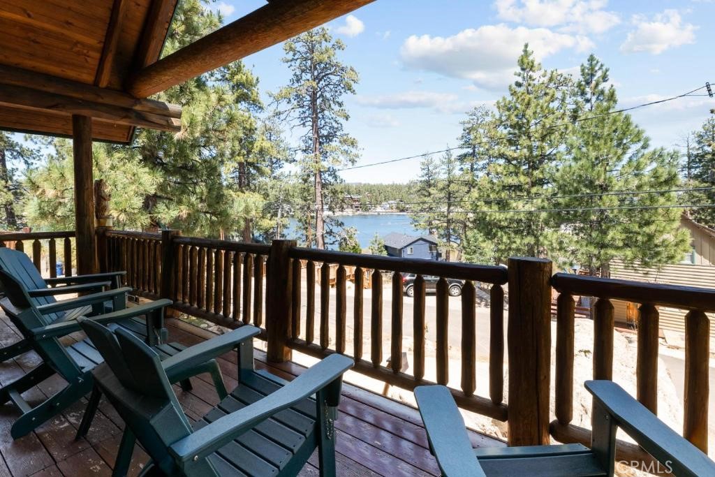 Experience the charm of Big Bear Lake in this unique, fully-furnished real log cabin with stunning lake views. Features a cozy 2-bedroom, 2-bath and a spacious den that can easily serve as a 3rd bedroom, perfect for guests or extra space. The centerpiece is the massive rock fireplace, reaching from floor to ceiling, which heats both the kitchen and living room. Radiant floor heating throughout, plus two tankless water heaters, ensure comfort year-round.
Ideally located just a short drive from downtown Big Bear, ski resorts, parks, museums, shopping, and all the area’s best attractions, this cabin is a proven prime short-term rental income property. Whether you're looking for a lucrative investment, vacation home, or full-time residence, this property offers flexibility and charm. With a walk-in closet in the master, a spacious attic, and a desirable neighborhood, with a wonderful view of the lake from your patio, this log cabin is truly a gem. Don’t miss your chance to own a piece of Big Bear.