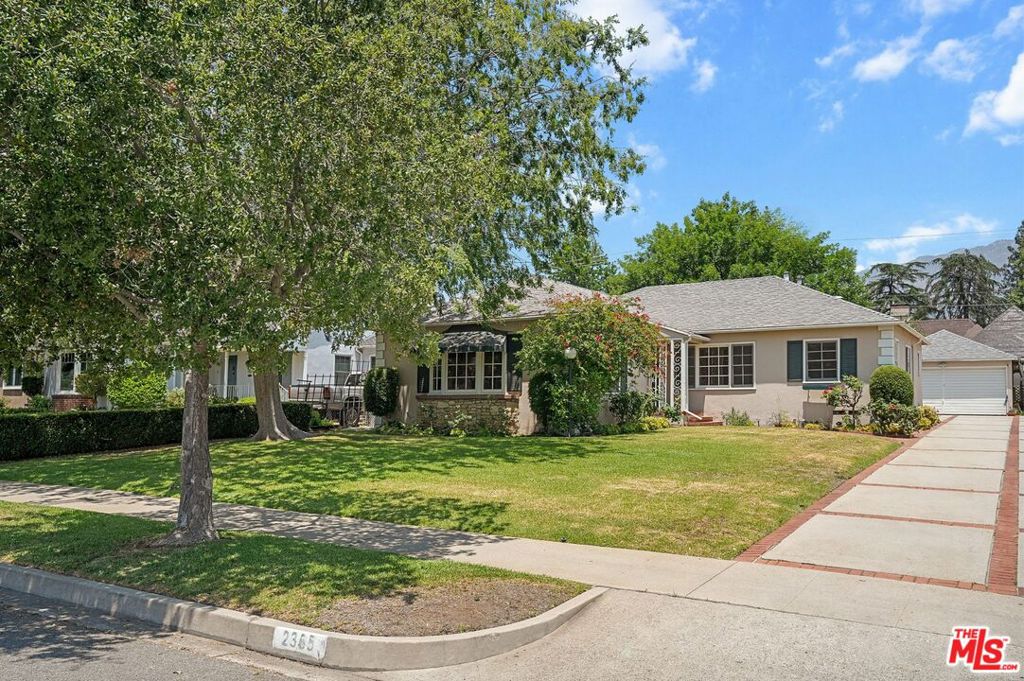Welcome to this well-loved 3-bedroom, 2-bathroom traditional home nestled on a picturesque, tree-lined street in the highly sought-after Casa Grande neighborhood of Pasadena. Set on a generous 8,702 sq. ft. lot, this inviting residence offers classic charm, abundant natural light, and timeless appeal. Inside, the spacious living room features a cozy fireplace and a large bay window that frames the front yard and bathes the room in sunshine. Perfect for hosting, the elegant formal dining room is adorned with wainscoting and flows into the charming eat-in kitchen, perfect for casual meals and everyday living. All three bedrooms are light-filled and inviting, with two overlooking the peaceful backyard. One features an en-suite bathroom, while the other two share a hallway bath with vintage charm, including original pink tile. Step outside to a beautifully maintained backyard that invites both relaxation and recreation. A covered patio provides a tranquil space for al fresco dining, while the open grassy area is perfect for play, gardening, or simply unwinding under the shade of a mature tree. Behind the detached two-car garage, you'll find a versatile shed for extra storage or creative use. Additional highlights include a California basement for convenient storage, central HVAC, and a detached two-car garage offering both parking and workspace. Enjoy the best of Pasadena living with close proximity to Victory Park and its beloved farmers market, Eaton Canyon trails, the scenic Roseway bike path, and easy access to CalTech, PCC, and the vibrant shops and restaurants of Old Pasadena. This is a rare opportunity to own a classic home on a spacious lot located in a beloved pocket of Pasadena known for its charm and community feel. Property is virtually staged.