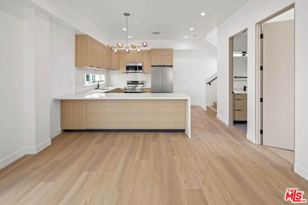 ** 2-WEEKS FREE PROMO - SEE FULL DESCRIPTION ** BRAND NEW CONSTRUCTION ** PRIVATE ROOFTOP DECKS ** 2-CAR PRIVATE GARAGE ** WASHER/DRYER ** CENTRAL A/C ** KITCHEN ISLAND ** PET FRIENDLY ** Welcome to Hortense Townhomes, a brand-new luxury residence in the heart of North Hollywood offering high-end finishes, spacious interiors, and unbeatable amenities. These thoughtfully designed units feature expansive living rooms, oversized bedrooms, and open-concept layouts perfect for modern living. The chef's kitchen boasts a large island, beautiful stainless steel appliances, quartz countertops, and custom cabinetry. Each unit includes an in-unit washer and dryer, central A/C and heat, recessed lighting, and premium flooring throughout. Enjoy your own private garage plus an assigned parking space for added convenience. The building is pet-friendly and offers an incredible shared rooftop deck with sweeping city views for relaxing, entertaining, or working from home in style. Located on a quiet residential street yet minutes from the vibrant NoHo Arts District, Toluca Lake, studios, shops, restaurants, and transit. This is elevated urban living at its finest. Don't miss your opportunity to call it home! ** FIRST 2-WEEKS FREE PROMO - PRICE SHOWN WITH 12 MONTHS BUDGET SPREAD - PRICE $5,800 **