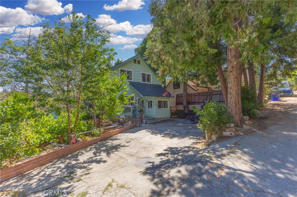 Welcome to 29239 Lake Brook Avenue, a charming mountain retreat nestled in the peaceful community of Cedar Glen. This cozy three-story home features 3 bedrooms, 2 bathrooms, and 1,312 sq. ft. of comfortable living space—perfect for year-round living or a weekend escape. Step inside to a warm and inviting interior highlighted by a beautiful fireplace, ideal for cozy evenings. The home boasts a brand-new roof and new windows throughout, offering both peace of mind and energy efficiency. The functional layout includes spacious bedrooms and great natural light, creating an airy and welcoming atmosphere. Situated on a 3,000 sq. ft. lot, the property offers low-maintenance outdoor space with all the perks of mountain living. Conveniently located near Lake Arrowhead, hiking trails, and local amenities, this home is a wonderful opportunity for full-time residents, vacationers, or investors seeking a peaceful getaway with modern upgrades.