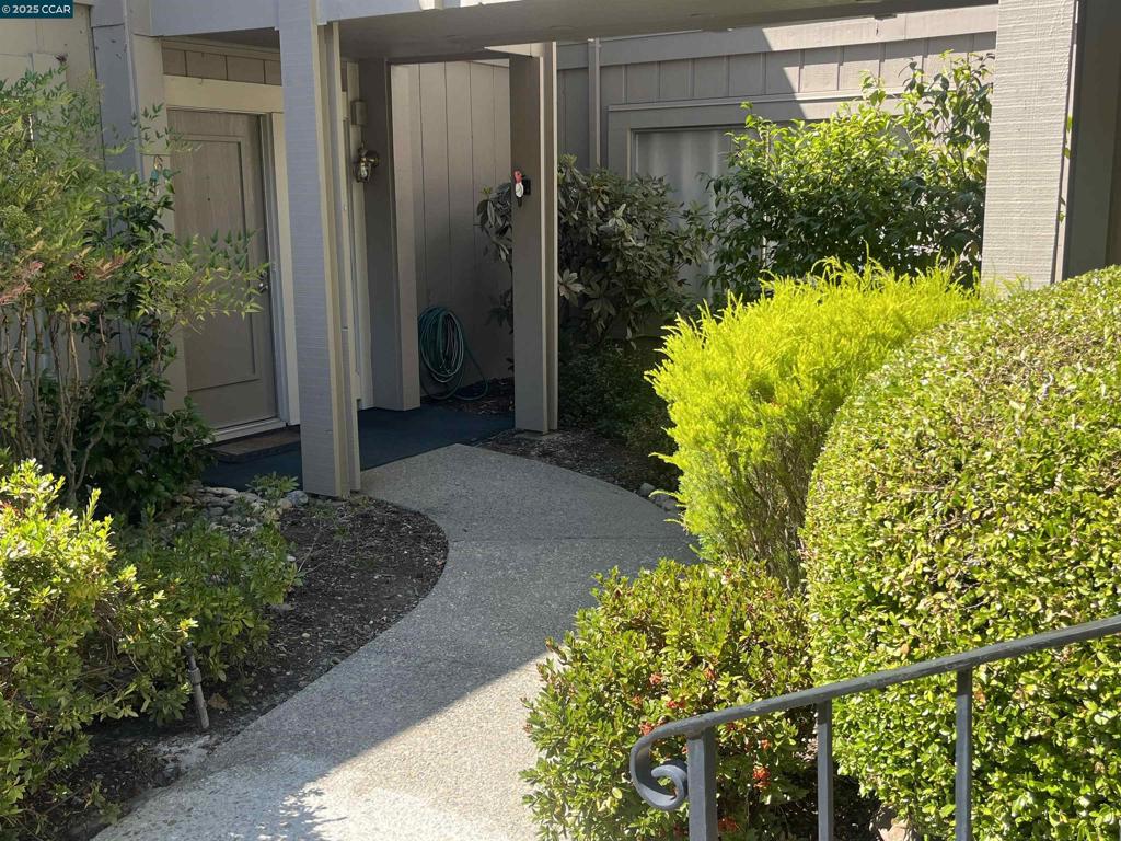 Lovely Sierra in a very private location with a level out back patio. This floor plan has large formal dining room, Living Room with access to a patio with wrought iron fencing, perfect for dogs. The 2 bedrooms are large and the primary has lovely private views. Primary has a walk-in closet. Guest room has double door glass closet doors for great storage. Full inside laundry room. Centra heat and air. Lovely kitchen updated with additional backdoor. Very gently steps down to the front door. 1 car garage and great guest parking.