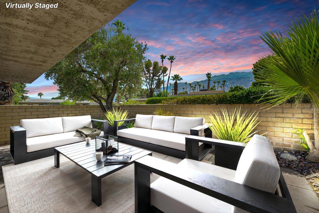 Stunning Mountain-View Condo in Sagewood - Enjoy iconic Palm Springs living in this fully upgraded 2BD/2BA end-unit located in Sagewood, an architecturally significant community designed by renowned modernist Donald Wexler. This home is situated on a premium lot with spectacular west-facing views of Mount San Jacinto, offering breathtaking sunsets and great natural light. The home has been thoughtfully renovated with luxury vinyl plank flooring, plush carpeting in the bedrooms, new interior doors and trim, and designer lighting. The kitchen features brand-new cabinetry, sleek countertops, a modern sink, and recessed lighting. Both bathrooms are updated with stylish vanities, tile, and spa-inspired finishes. A private patio off the living room provides a tranquil outdoor retreat surrounded by greenbelt. Floor-to-ceiling windows and large sliders create seamless indoor-outdoor flow. Includes a shared garage and end-unit privacy. Sagewood spans 18 park-like acres with just 108 homes, three pools and spas, a resurfaced tennis/pickleball court, and mature lush & desert landscaping. The HOA is financially sound and pursuing historic designation, which could allow homeowners to apply for Mills Act property tax savings. Located on fee simple land, minutes from downtown Palm Springs.
