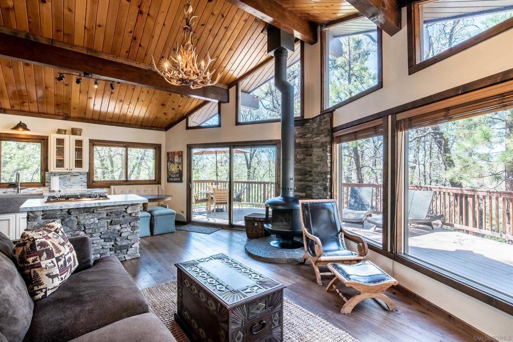 This beautifully renovated cabin combines modern comforts with rustic mountain charm. Situated in the highly desirable Moonridge neighborhood, it’s just minutes from the slopes, golfing, hiking trails, the lake, dining, shopping, and the zoo, offering the perfect balance of seclusion and convenience. This retreat features one bedroom, one bath, a queen sleeper sofa, plus a bonus loft (not included in square footage) that allows it to comfortably sleep six. Tucked up away from the street on nearly a quarter-acre, you’ll enjoy privacy and tranquility among mature pines and star-filled skies. The expansive over 600 sqft wraparound deck, outdoor spa, and BBQ area create an ideal setting for entertaining or unwinding after a day of adventure. Currently a very successful Airbnb, it has year-round appeal for personal enjoyment or investment, as it generates $75K–$105K annually and comes fully furnished for a true turn-key opportunity. A large storage shed completes the package. Rarely available in Moonridge—don’t miss this one!