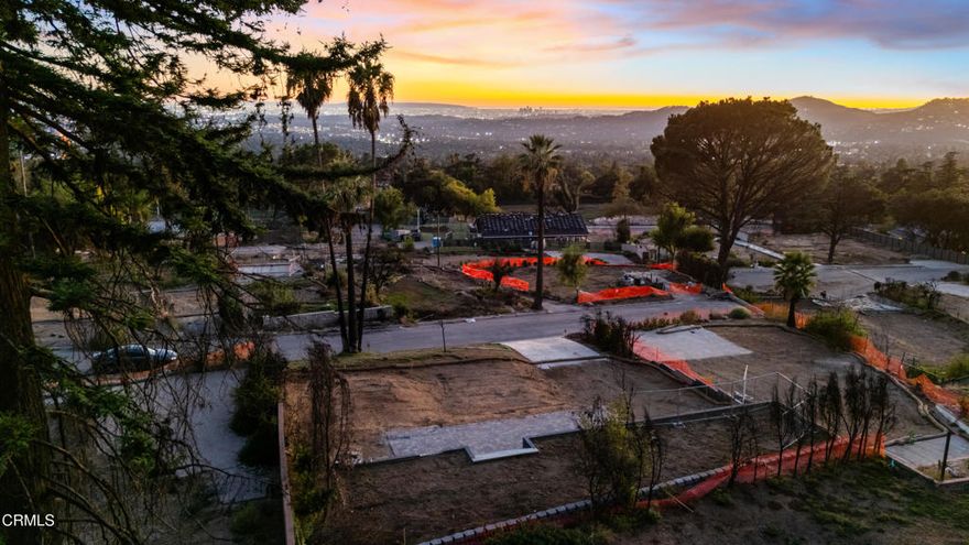Set high in the Foothills on a quiet cul-de-sac, this gently sloping 9,062 square foot site offers an exceptional opportunity to build in one of Altadena's most sought-after neighborhoods. Just moments from Farnsworth Park and the area's renowned trail network, it captures the essence of foothill living: clear mountain air, the scent of chaparral, and a peaceful setting with sweeping views of the San Gabriel Mountains, the valley below and unforgettable sunsets. A 1,692 square foot home once occupied the site, and under the Altadena Community Standards District guidelines, a new residence of nearly 3,000 square feet plus a separate ADU may be permissible. Both Phases I and II of cleanup and debris removal have been completed by the U.S. Army Corps of Engineers, and the parcel now qualifies for express lane rebuilding, streamlining the path to new construction.