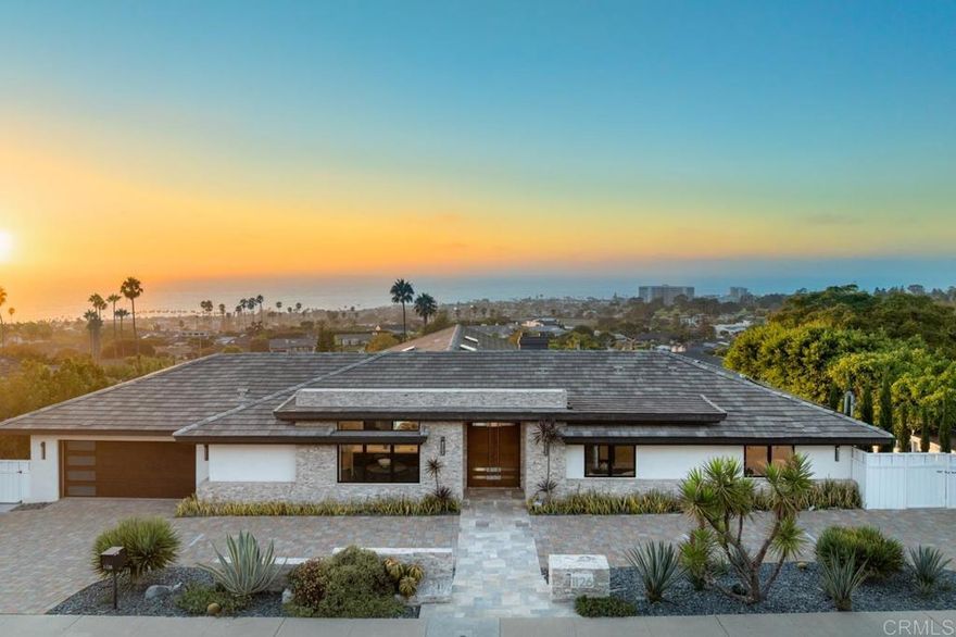 Timeless Luxury in La Jolla Muirlands! Discover the pinnacle of coastal elegance in this exceptional 6-bedroom, 6 bath, 6,077 sq. ft. residence nestled in the coveted La Jolla Muirlands. Framed by breathtaking ocean panoramas, this home embodies the effortless sophistication and vibrant lifestyle that make La Jolla one of the world’s most desirable destinations. Designed with entertaining in mind, the expansive great room opens seamlessly to a spectacular view terrace with a fire pit, creating the perfect setting for sunset gatherings. The gourmet chef’s kitchen, complete with top-of-the-line appliances and custom finishes, flows outdoors to a resort-style pool kitchen with a wood-fired pizza oven. Sparkling pool with cascading waterfall, spa, and abundant terraces offer the ultimate in relaxation and al fresco dining. Inside, rich walnut floors and refined details set a tone of timeless luxury. The primary suite is a serene retreat, featuring a spa-inspired bath with hydro-system soaking tub. With six spacious bedrooms and generous living areas, there is ample space for family and guests to enjoy privacy and comfort. All of this is just minutes from La Jolla’s renowned beaches, coastal trails, and the charming Village—where world-class boutiques, art galleries, and restaurants await. This home offers not just a residence, but a lifestyle defined by luxury, leisure, and the unparalleled beauty of La Jolla.