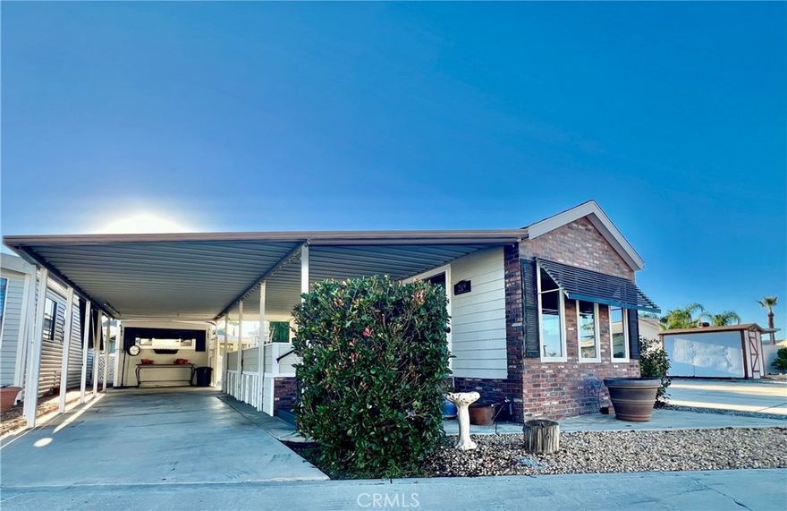 OWN YOUR LAND! Desired Mountain Shadows RV Resort 55+ Gated Community. Charming Alfa 1987 Park Model Approx 400 Sq Ft of Living Space. Full Length Covered Patio Is Great for Enjoying Your Favorite Morning or Afternoon Beverage. Enter Through the French Doors to the Open Floor Plan Kitchen with Full Size Refrigerator, Free Standing Propane Stove, Garbage Disposal & Lots of Extra Cabinetry. Open To the Living & Dining Room with Built-In bookshelves. The Master Bedroom Has Mirrored Wardrobe Closet Doors & Built-In Cabinetry. Bathroom Has a Decorative Pedestal Sink & Shower Tub Combo. Wood Flooring, Mini Split AC/Heating Unit & Electric Hot Water Heater. Improved Oversized Storage Shed used as a Workshop. The Land Is an Oversized "A" Lot Approx 2614 Sq Ft. Covered Carport & Low Maintenance Landscaping. Two Clubhouses to Choose from With Lots of Amenities Including Heated Saltwater Pool, Spas, Indoor & Outdoor Kitchens, Auditorium, Billiard Room, Shuffleboard, Gyms, Laundry Facilities, Restrooms & Showers, Horseshoe Pit, Corn Hole, Ping Pong Tables & More. LOW TAXES & HOA FEES Of Approx $292.00 "ONLY" A Month Includes Water, Sewer, Trash Basic Cable & Internet. Turnkey & Move in Ready! Retirement At Its Finest!