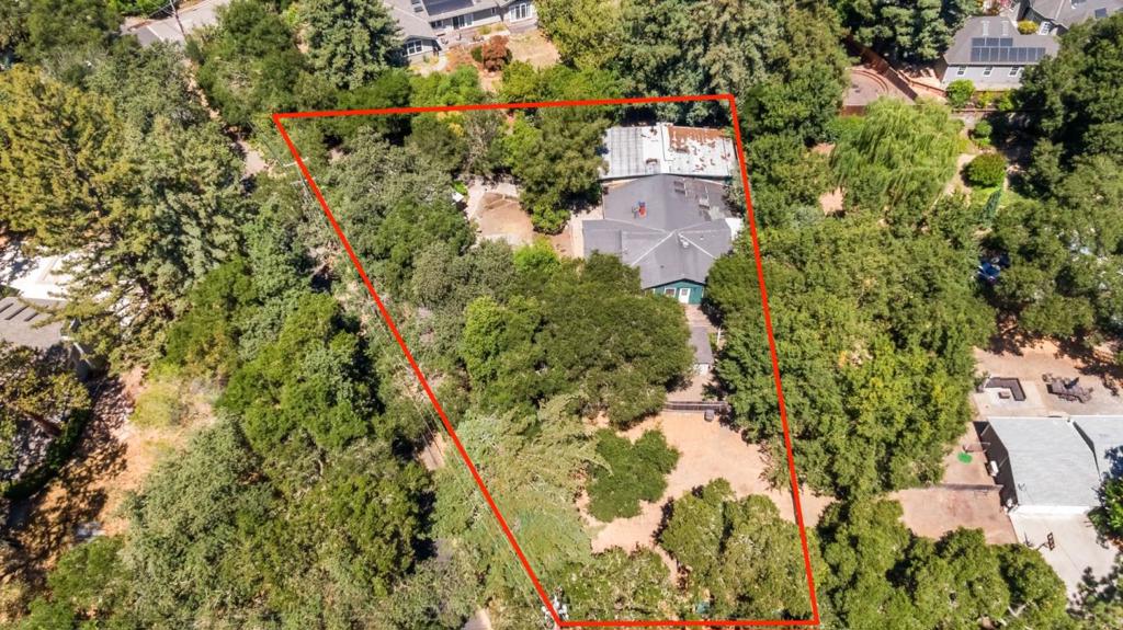 Private ~half-acre property is prime for redevelopment with an existing 3,365+/- sf house and ADU* with 5BDs and 5BAs, a carriage house with studio, paddock, two access gates and multiple outbuildings. This highly coveted location is within 0.5 mile of Woodside Village with Roberts Market, Bucks, the library, The Village Pub (Michelin starred), Village Hub and Village Bakery and Cafe, and near top rated schools, miles of hiking, biking and horseback riding trails and surrounding open space preserves. Nestled in the foothills of the Santa Cruz Mountains between the Pacific Ocean and SF Bay, Woodside is one of the wealthiest communities in Silicon Valley and the U.S. It is renowned for its natural beauty, redwood forests, equestrian culture, sprawling estates, high-profile residents and proximity to Stanford, venture capital firms and tech hubs like Palo Alto and Menlo Park. It is about 30 minutes from San Francisco and the coast, 1.5 hours from Napa Valley and located between two international airports and private jet centers. Affluent, private and understated, this scenic rural town of about 5,100 residents offers a low-key lifestyle and tranquil retreat within easy reach of thriving epicenters. *Some structures may have been built without permits; buyer to investigate.
