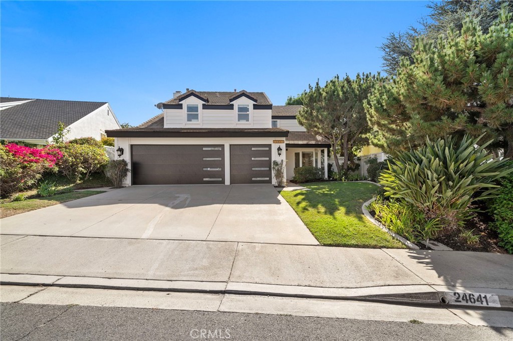 Better Than New! This breathtaking 5BR/4BA luxury home has been fully remodeled with COMPLETE CITY-APPROVED PERMITS. No HOA & Low Taxes. This spacious, fully upgraded home offers the feel of new construction with none of the wait. Features 1 bedroom and 1 full bath downstairs plus 4 bedrooms and 3 baths upstairs — including two full master suites ideal for multigenerational living or growing families.
The main floor bedroom includes a private bath, cozy fireplace, and sliding door with direct access to the backyard — perfect for guests or a home office.
The expansive great room opens to a designer chef’s kitchen with a Taj Mahal quartzite waterfall island, Viking appliances, custom cabinetry, and a new water softener. Sliding doors lead to a beautifully landscaped, generously sized backyard with mature trees, a large patio, custom gazebo, nice yard, and nice side yard ideal for pets, gardening, or entertaining. There’s also plenty of room to add a pool and create your dream outdoor space.
No detail was overlooked: new lighting and chandeliers, recessed lights with night mode, smart switches, dual-pane windows, fresh interior/exterior paint, new laminate wood floors, and mostly new plumbing and electrical. All bathrooms feature walk-in glass showers, freestanding soaking tubs, smart luxury toilets, LED mirrors, dual vanities, and floor-to-ceiling porcelain tile.
Also includes a large indoor laundry room with new washer & dryer, and a finished 3-car garage with epoxy floors.
Walk to parks, Laguna Hills Plaza, Target, and more plus less than 9 miles to world-famous Laguna Beach. This home blends style, function, and location turnkey and ready to impress!
