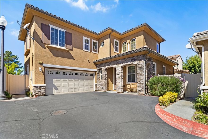 Welcome to this Stunning Santa Clarita home in highly sought- after Milestone Gated Community!! NO MELLO-ROOS!! This dream home has 4 Bedrooms, 2 1/2 Bathrooms with over 2000 sqft of living space. This meticulously maintained home features a living room , Kitchen with granite countertops and stainless steel appliances , a huge family room for your relaxation and entertainment. It has an elegant wood flooring though out the main floor. The upstairs has 4 spacious bedrooms with a huge master suite, master bathrooms with double sink and large walk-in closet. Added features are 2 car garage with direct access, plenty of cabinet space for storage, covered patio and large paved backyard . The community offers plenty of amenities for your family activities , it has swimming pools, spa and 2 playgrounds for your little ones to enjoy, it is a gated community with security monitoring for your pease of mind. The location is the BEST!! Easy access to freeway 14, close to schools, shopping { Costco, Sam’s Club, Super Walmart, Target etc…} and near by great restaurants. No need to say more, make this your forever home. MUST SEE!!