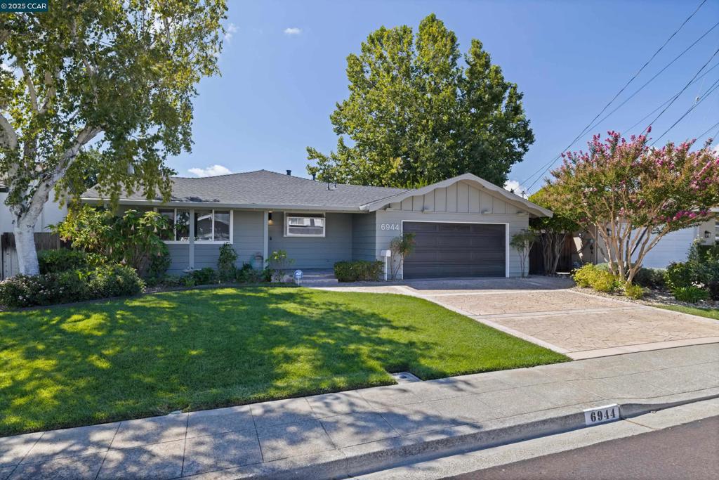 Welcome home to this wonderfully updated rancher combining classic charm with modern amenities. Step into the spacious living room featuring a bright picture window, brick wood-burning fireplace, and old-world hardwood floors. The granite chef’s eat-in kitchen is complete with newer appliances, concrete backsplash, bay window, an over-sized breakfast nook, and a door to the back patio. The expanded primary suite is complete with canned lights, a walk-in closet, and a spa-like bathroom with a spacious tile stall shower. The other two bedrooms feature bright picture windows and ample closets. Other features include a beautifully manicured, level .13 acre yard, featuring a covered front patio and entertaining back patio, an over-sized two car garage, and abundant storage, all just minutes to shops, restaurants, parks, transportation and schools.