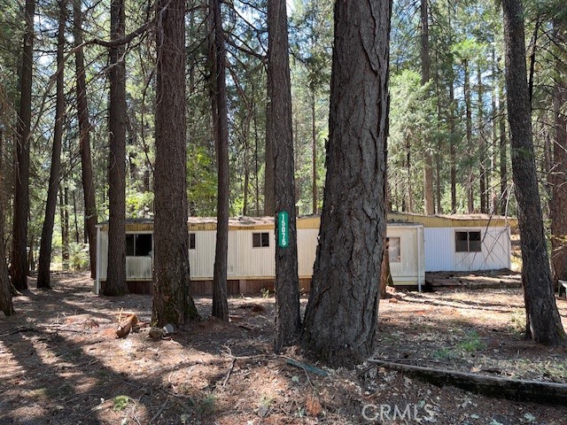 Tucked away at the end of a quiet cul-de-sac, this .69 acre lot offers peace, privacy, and endless potential. The property currently has a mobile home of no value, but it’s already equipped with essential utilities, making it easier to bring your vision to life. Surrounded by mature trees, this location provides a serene setting with the convenience of an established neighborhood. Whether you’re looking to build your dream home or invest for the future, this property is full of opportunity.