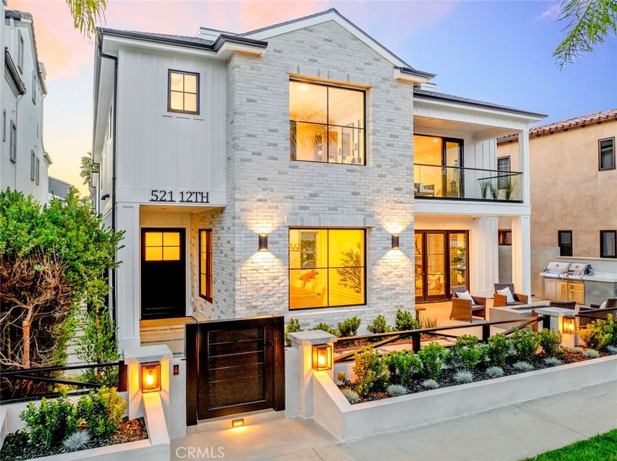 This stunning 5,500 Sqf. 3-Story Beach House was designed by Master Builder and Designer Bobby Kashani, founder of Olive Avenue Homes. This flawless farmhouse signature home features an absolutely blissful kitchen with a massive island, 2 dishwashers, 7’ of state of art refrigeration, a 60” Wolf Range and a 2nd  Kosher Kitchen that will leave you captivated. This home features 4 bedrooms, a large downstairs home office, a deluxe-sized family den, and a massive 3rd floor suitable as a large gym, game room, or 3rd story 5th bedroom. The Primary Suite is an absolute gem with a Primary closet and bathroom that are nothing short of inspirational. The homes comes with an oversized 3 car garage, a 44 foot lap pool and spa combo, gym room, 2 sets of premium built-in washer and dryer units in a full laundry room, resort size elevator, roof top deck, 50 feet of front yard frontage and all of the Smart Home Features including an integrated solar panel system. The finish schedule is top of line and too long to list. Custom built-in inset Cabinetry coupled with White Oak Inset Cabinetry throughout,  60” Wolf Range, Thermodar Appliances, Italian Marble tops, Large Savaria Elevator, Restoration Hardware Lighting and Fixtures, Elegant wainscoting and wood paneling to accentuate the focal areas and collectively tie-in the entirety of a tasteful design palette.