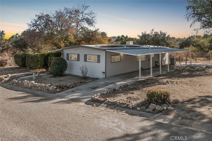 Modern, Fully Renovated Home with Paid Solar and Expansive Lot, a beautifully updated 3-bedroom, 2-bath manufactured home on a permanent foundation with 433A certification, located at the end of a quiet cul-de-sac in the Gavilan neighborhood. This move-in-ready home features a modern open floor plan with new stylish flooring, a completely remodeled kitchen, updated bathrooms, upgraded lighting, fresh interior and exterior paint, and a new central A/C system. The enclosed patio is filled with natural light from newly installed windows, offering peaceful views of the surrounding landscape. Energy-efficient living is ensured with a fully paid-off solar system. Situated on a spacious 10,000+ sq.ft. lot, this property provides plenty of room for outdoor entertaining, gardening, or future customization. Ideal for buyers seeking privacy, space, and turnkey upgrades throughout. Don't miss this incredible opportunity—schedule your showing today!