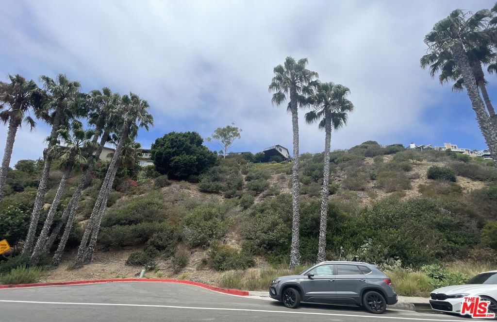 A once-in-a-generation opportunity in the prestigious Portofino Estates of Laguna Beach, this rare 15,925 sq. ft. double parcel featuring a 10,454 sq. ft. main lot (available for $969,000) along with 414 Nyes Pl, a 5,471 sq. ft. access strip, offers sweeping explosive ocean and sunset views. Perfectly positioned across from Victoria Beach and near the Montage Resort, you'll enjoy walkable access to coves, dining, and boutique shops, with downtown Laguna just minutes away for art, culture, and nightlife. An ideal canvas for designing a modern coastal retreat or a legacy family compound, this remarkable lot combines privacy, prestige, and an unparalleled location in one of Southern California's most sought-after enclaves.