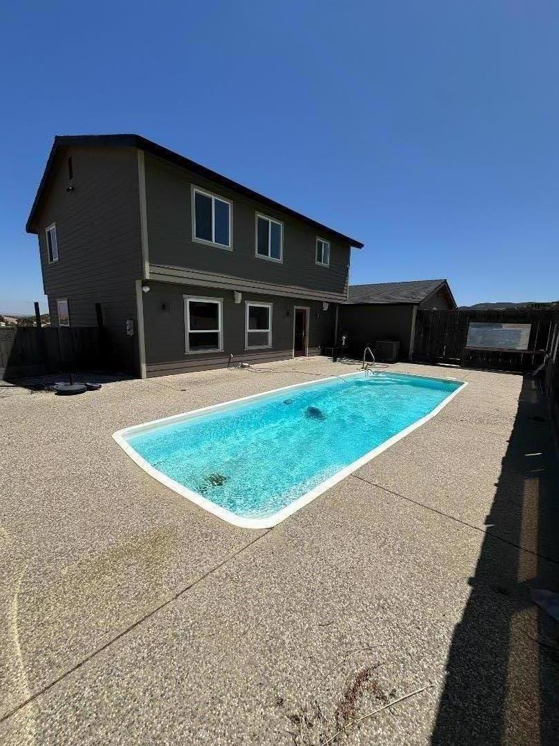 Welcome to a spacious 4-bedroom, 2-bathroom home located In King City the opportunity is knocking once again to own a stunning property in South County. This property offers approximately 1,995 square feet of comfortable living space. The kitchen is a standout feature, equipped with quartz countertops, a built-in oven, microwave, island, pantry, and exhaust fan ideal for culinary enthusiasts and family meals. The home boasts elegant wood flooring throughout, providing warmth and style. Enjoy cozy family gatherings in the family room. Ceiling fans ensure optimal cooling, while forced air heating keeps you comfortable year-round. Outside you approximately 2.5 acres for horse property and escape to your own private oasis complete with a sparkling pool and ranch-style fencing, providing both security and charm. Relax and unwind as you soak in the stunning views of the King City lights twinkling below and the majestic Laguna Mountains stretching out in the distance. Additional features include updated septic system, ensuring peace of mind for years to come. Whether you're lounging by the pool or enjoying a cozy evening indoors, this property offers the ultimate in California living. Don't miss your chance to experience luxury living at its finest.