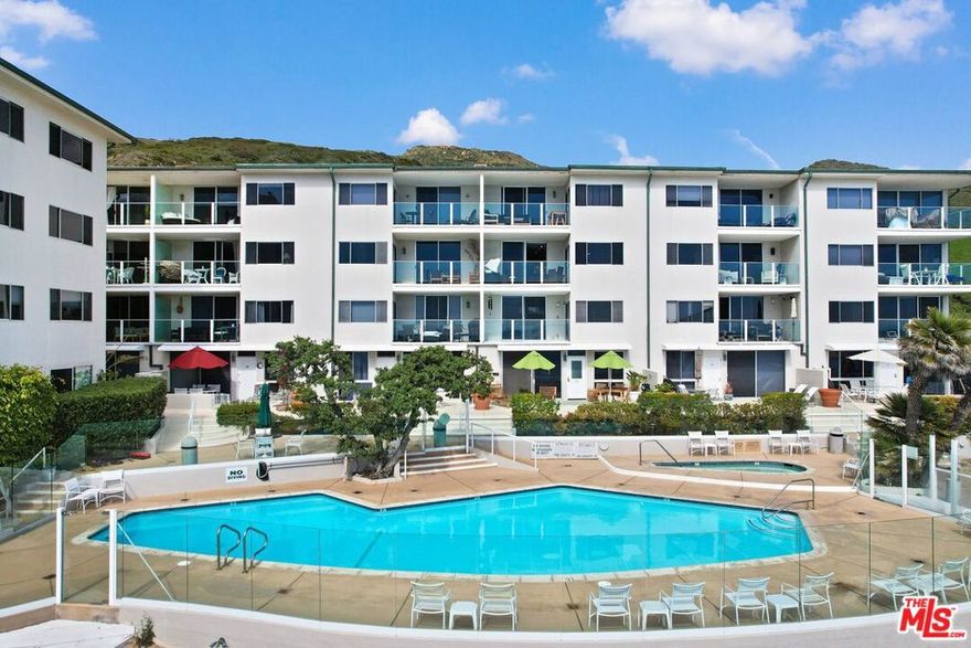 Experience luxury beachfront living at its finest in this beautifully remodeled 2-bedroom, 1-bathroom condominium nestled on Carbon Beach in Malibu. Step into a world of contemporary comfort, where every detail has been thoughtfully curated to provide the ultimate fully furnished coastal retreat. Upon entering, be greeted by a seamless blend of neutral tones, ocean views from the comfortable reclining sofas, and a large dining area for entertaining. The renovated kitchen boasts new stainless steel appliances, sleek countertops, and abundant cabinet space. Indulge in breathtaking sunsets and mesmerizing Pacific waves from your private balcony, offering unparalleled views of the ocean and horizon beyond. With direct access to a private sandy beach, immerse yourself in the tranquility of the pristine shoreline or take a refreshing dip in the sparkling swimming pool or spa. For those seeking culinary delights, shopping experiences, or simply a moment away from it all, world-renowned destinations such as Nobu, Soho House, Malibu Country Mart, Malibu Lagoon, and "Billionaires Beach" are located nearby. Relish in the convenience of secure building access and covered parking, ensuring peace of mind and comfort for residents and guests alike. Whether you're seeking relaxation, recreation, or entertainment, this Malibu condominium offers an unparalleled coastal lifestyle that epitomizes luxury, comfort, and convenience. One year lease is preferred, but negotiable.