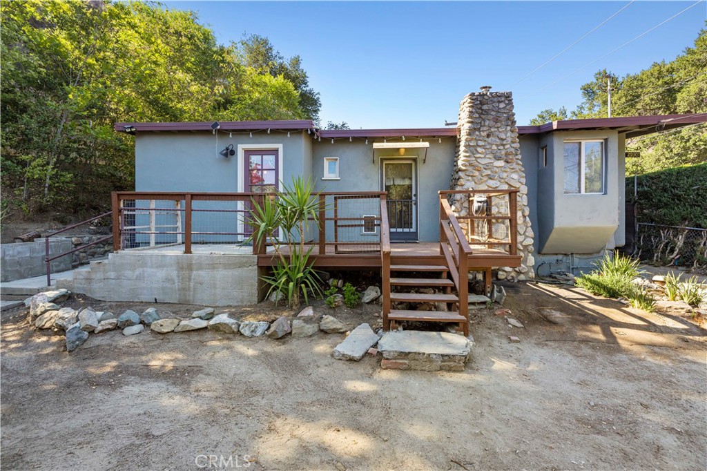 This unique property has a spacious lot with both a main house and a GUEST HOUSE!! Each thoughtfully updated while preserving historic charm. The main house features a brand new split-unit air conditioning system, modern ceiling fans and lighting, and exquisite flooring made from rare, ancient wood. A cozy gas fireplace adds warmth and character, and the home includes a beautifully preserved 100-year-old Murphy bed with a mirror, adding a touch of history and function. The kitchen is equipped with lots of storage and great lighting. All utilities are included for added convenience.
The guest house is equally inviting, with a new motor and split-unit air conditioning system, as well as a compact built-in bedroom or closet space. It also comes with its own kitchen and full bathroom!
Outdoors, the property features drought-tolerant landscaping and a greenhouse perfect for gardening enthusiasts, along with a dedicated workshop ideal for creative projects, storage, or hobbies. At the upper end of the property, a walking trail winds through lush vegetation, following historic paths that are over a hundred years old. This one-of-a-kind retreat blends modern comfort with timeless natural beauty.