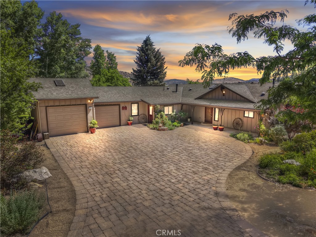 This is a unique Big Bear property ~ A one story ranch style home on over 8 acres ~ Owned and lived in by the same family since 1979 ~ They are now giving you the opportunity to add to the home's story ~ From the moment you pull up, you will fall in love ~ The pavered driveway gives you plenty of parking at the front of the house and the attention to detail in the landscaped front yard lets you know that this is a place of peace ~ As you enter the home into the living room, your eye will first be drawn to the custom fireplace that features a beautiful blend of native rock and brick, a truly unique design ~ Then you see the kitchen with its hardwood floors and solid wood beam over the log slab breakfast bar ~ The master bedroom is huge with its own access to the backyard ~ The freshly remodeled master bathroom boasts granite countertops, matching granite bathtub deck, tiled walk-in shower and wood grain tile flooring ~ As you venture to the backyard, this is where the magic truly begins ~ You have a large side patio for BBQing and a huge grass backyard for playing with the kids and pets ~ Then you move past that to your barn and horse corrals ~ Beyond the barn and corrals your land stretches out for over another 6 plus acres towards Baldwin Lake ~ Whether you are looking for horse property or home base to gather with all of your loved ones for quality time and making memories, this home gives you the quality, charm and space for whatever your imagination can come up with!